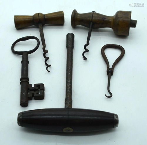 A group of vintage corkscrews, keys etc . (5).