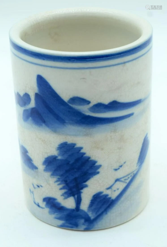 A Chinese blue and white brush pot decorated with a