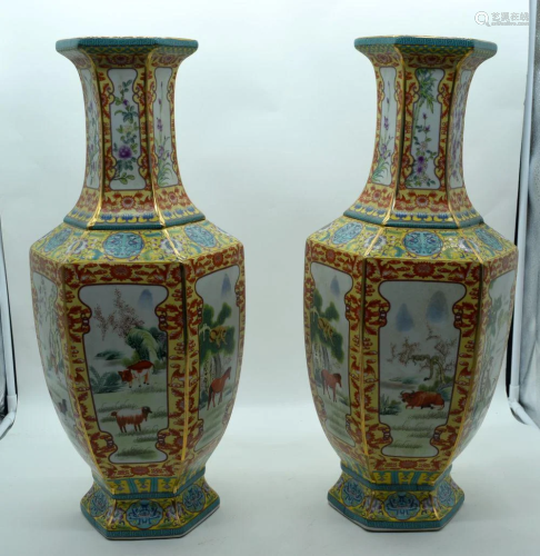 A pair of large Chinese Famille Jeune vases decorated