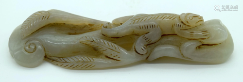 A Chinese Jade carving of a Lizard on a plant 12cm.