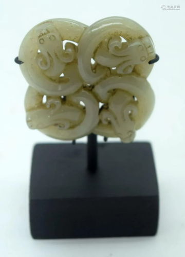 A Chinese Jade Plaque on a stand decorated with snakes