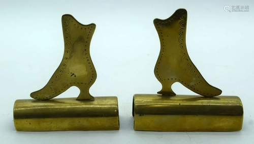 A pair of brass folk art boots possibly shop display.