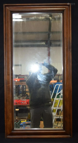 A large wooden framed mirror with bevelled glass 60 x