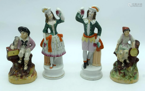 A pair of Staffordshire figures together with two