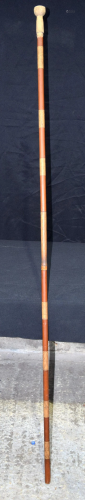 A Burmese bamboo blow pipe 190 cm.