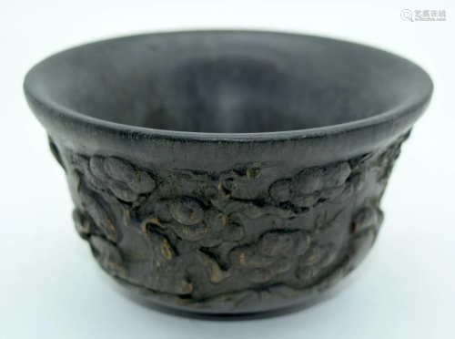 A Chinese carved horn Libation cup 7 x 13cm.