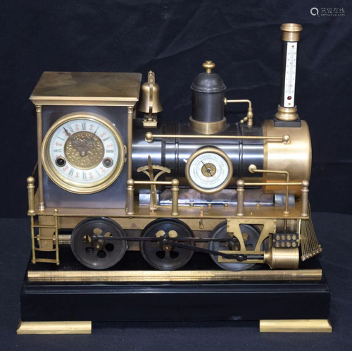 A Locomotive clock on a rail plinth. 46 x 23cm (2)