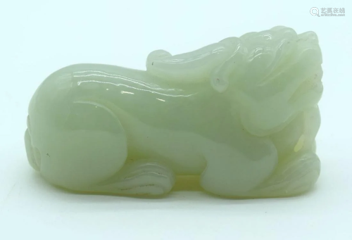 A Chinese jade paperweight in the form of a Lion. 7cm