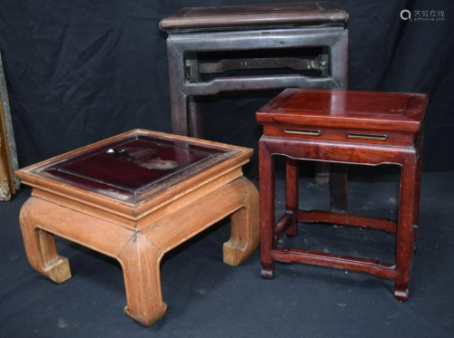 A Chinese hardwood table together with two others .