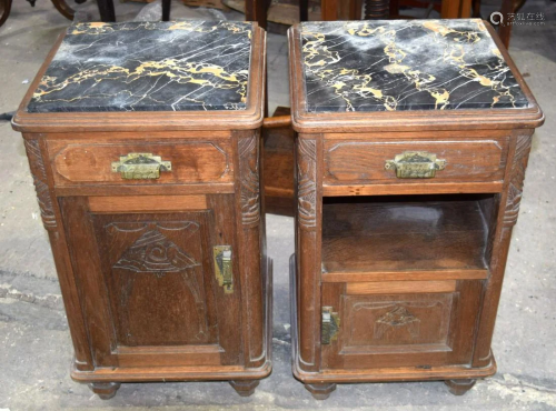 A pair of Edwardian carved panel Oak bedside cabinets