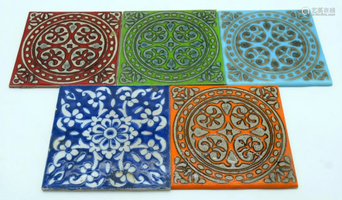 A collection of vintage ceramic tiles in an Islamic
