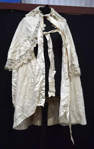 A Victorian silk house coat, a lace skirt and a bed