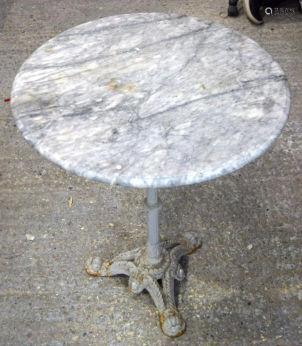 A Marble top garden table with an ornate cast iron legs
