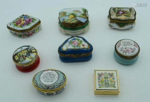 A collection of small porcelain and enamel boxes