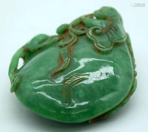 A Chinese carved jade boulder of a lizard on a rock