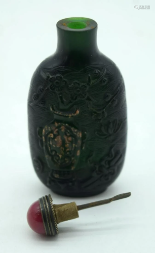 A Chinese carved Snuff bottle decorated with a gilded