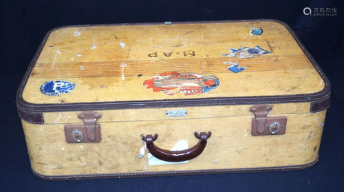 A vintage canvas covered suitcase with Bakelite handle