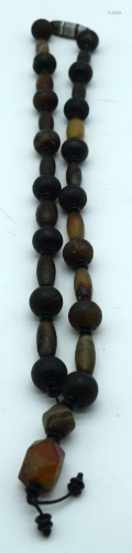 A Chinese hardstone and agate necklace 90cm.