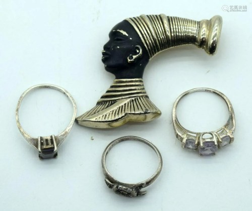 Three silver (925) rings and a gild broach of an