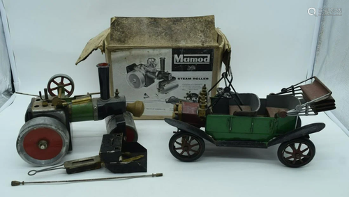 A vintage Mamod steam powered rolling machine and a tin