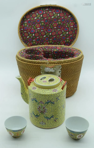 A Chinese Famille jeune porcelain teapot and two tea