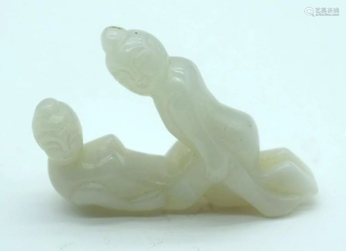 A Chinese carved Jade boulder of a couple copulating