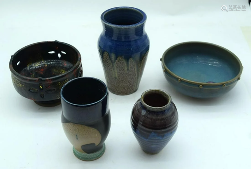 A collection of glazed studio pottery bowls and vases