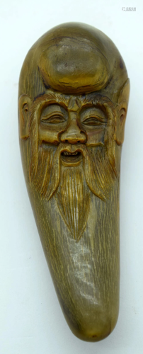 A Chinese carved horn figure of a sage 13cm.