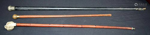 A Buffalo horn handled walking cane together with two