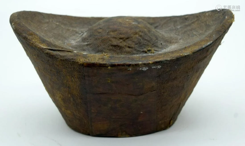 A Chinese compressed Tea block in the form of an ingot