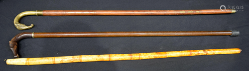 A Chinese sectional bone walking cane with carvings