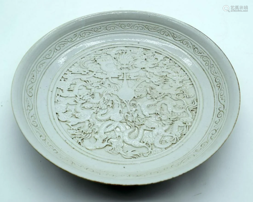 A Chinese dish decorated with dragons in relief 5 x 28