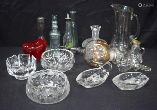 A collection of glassware items decanters, wine filter,
