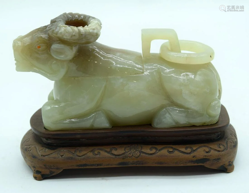 A carved Jadeite boulder carved as a Ram with a lid on