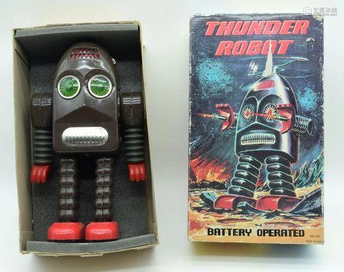 A vintage boxed tin plate Thunder robot battery