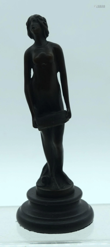 A small bronze figure of a female on a plinth 16cm.