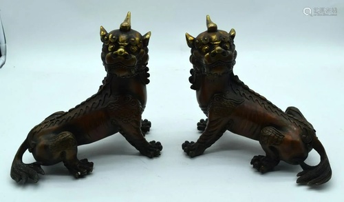 A pair of Tibetan bronze Kylin beasts 20 x 25cm. (2)