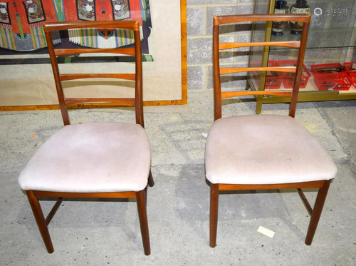 A pair of Danish teak upholstered chairs by Kvist. 93