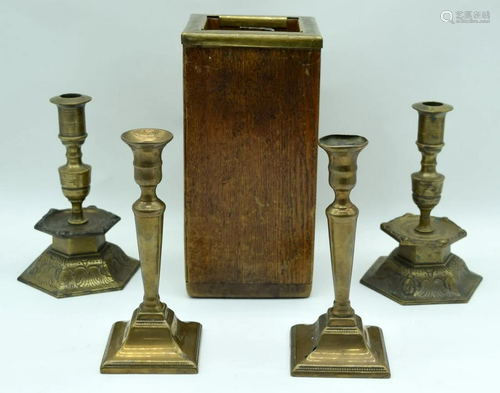 A pair of brass candlesticks together with a pair of