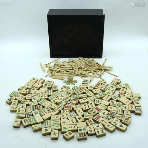 A Chinese boxed wood and bone mahjong set (151