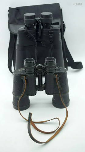 A pair of Bushnell binoculars together with a set of