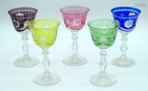 A collection of coloured crystal wine glasses (5).
