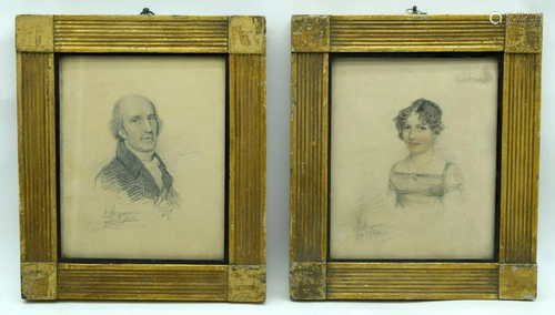 A pair of framed 18th C charcoal portraits relating to