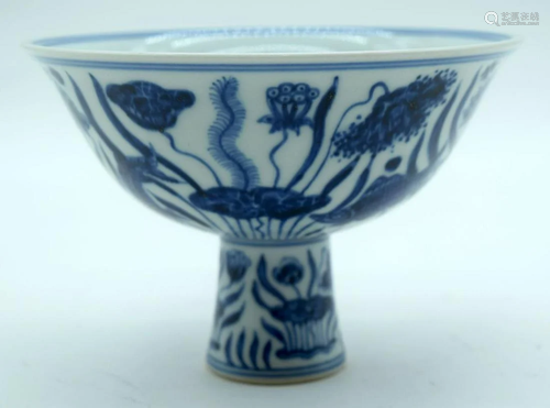 A Chinese blue and white stem cup decorated with carp