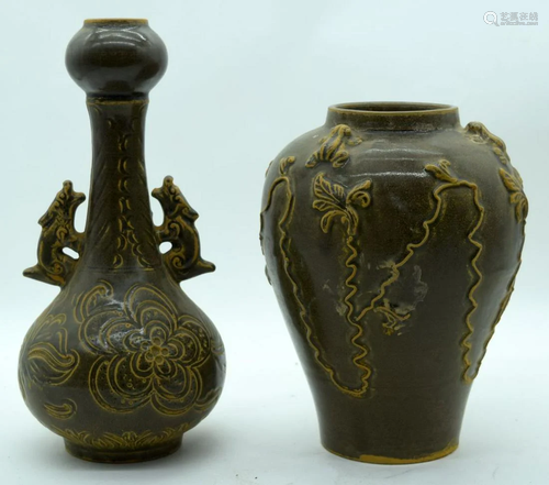 A Chinese twin handled vase decorated with foliage in