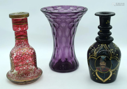 A Persian glass vase together with another similar and