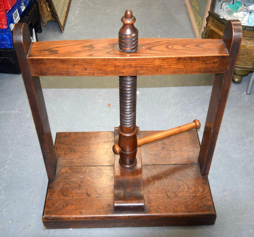 AN ANTIQUE BOOK PRESS. 77 cm x 67 cm x 46 cm.