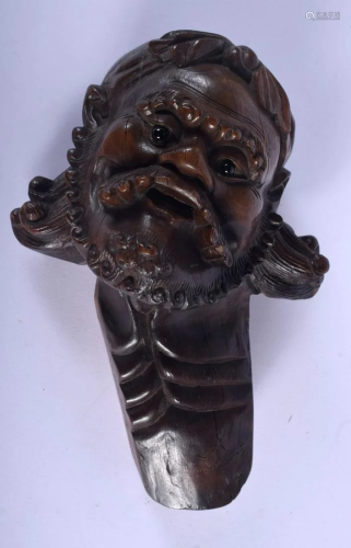 A 19TH CENTURY CHINESE CARVED ROOTWOOD BUST OF A M…