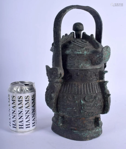 A CHINESE SWING HANDLED BRONZE VASE AND COVER 20th