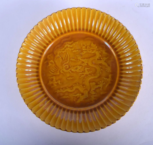A CHINESE YELLOW GLAZED CHRYSANTHEMUM MOULDED DISH …